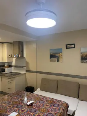 a living room with a couch and a table at SOLEA 17 in Rota
