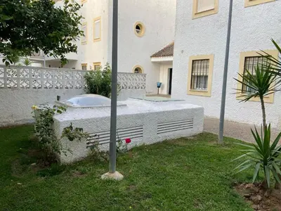 a bath tub in a yard next to a building at SOLEA 17 in Rota