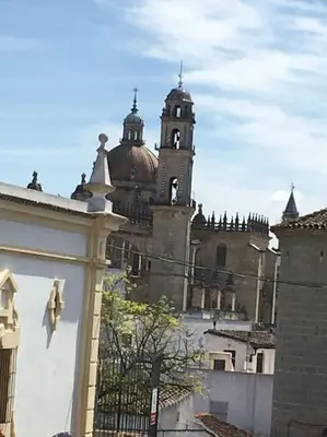 a large building with a clock tower in the background at Loft Bodega San Blas con porche y parking in Jerez de la Frontera