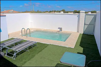 a small swimming pool on the side of a house at Chalet los Morenos in Conil de la Frontera