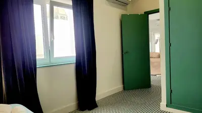 a room with a door and a window and a door at Casa Tina in Cádiz