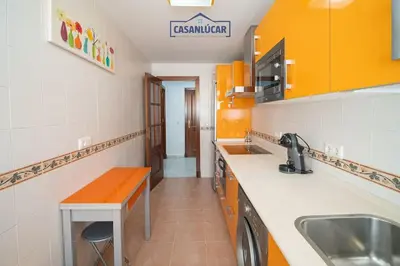 a kitchen with a sink and a counter top at Apartamento la Infanta in Sanlúcar de Barrameda