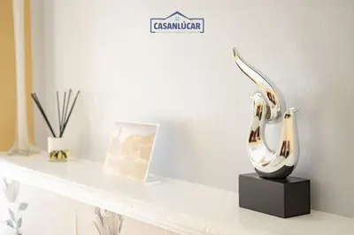 a pair of heels sitting on a shelf in a room at Apartamento la Infanta in Sanlúcar de Barrameda