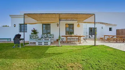 a pavilion in a yard with a table and chairs at Casa Rural Viña Romanito Jerez de la Frontera by Ruralidays in Jerez de la Frontera