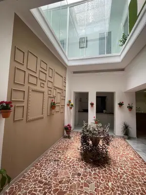 a large room with a glass ceiling and a room with plants at BF BOUTIQUE JEREZ in Jerez de la Frontera