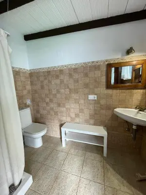 a bathroom with a toilet and a sink at Dúplex Céntrico perfecto para el disfrute in El Puerto de Santa María