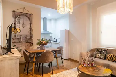 a living room with a table and a couch at Writer's Home by Cadiz Time in Cádiz