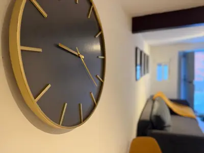 a clock hanging on a wall in a room at La Faraona in Jerez de la Frontera