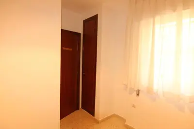 an empty room with a door and a window at Apartamento Paola in El Puerto de Santa María