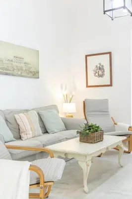 a living room with a couch and a coffee table at Playa de Regla, para un magnifico descanso. 3. in Chipiona