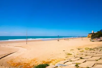 a sandy beach with the ocean in the background at La Barrosa con vistas al mar in Novo Sancti Petri