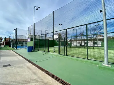 a tennis court with a net on a tennis court at MyChoice Soleá in Rota