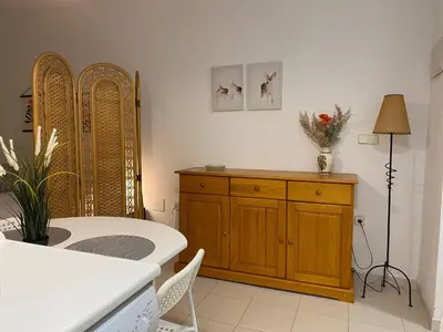 a kitchen with a table and a dining room at MyChoice Soleá in Rota