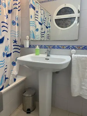 a bathroom with a sink and a mirror at MyChoice Soleá in Rota