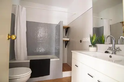 a bathroom with a sink and a toilet and a tub at Apartamento Albareda Centro in El Puerto de Santa María