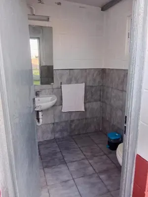 a bathroom with a sink and a toilet at La Casa de la Abuela Jesús in Sanlúcar de Barrameda