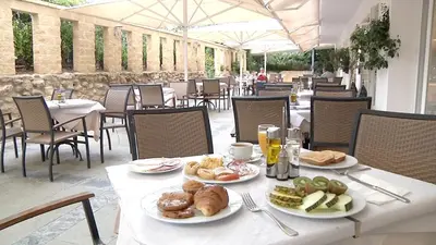 a table with plates of food on top at Garbí Costa Luz in Conil de la Frontera