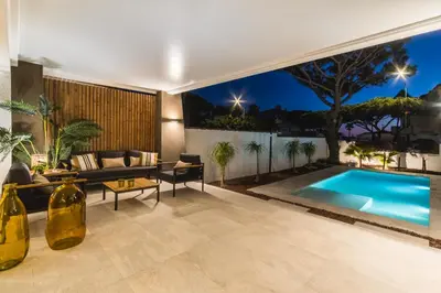 a living room with a swimming pool in a house at SIAT VIVIENDAS Villa carretera LA BARROSA in Chiclana de la Frontera