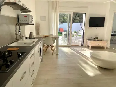 a kitchen with a sink and a tub in it at Minichalet El Molino 1 in Chiclana de la Frontera