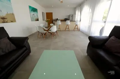 a living room with a couch and a table at Hacienda Laguna Seca - Apart. Buganvilla in Chiclana de la Frontera