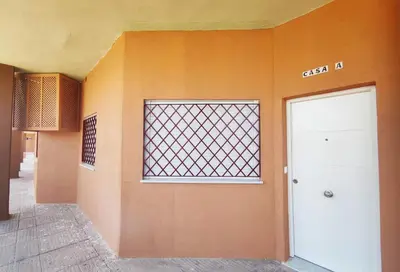 an empty room with a door and a window at APARTAMENTOS SANLUCAR CASA A in Sanlúcar de Barrameda