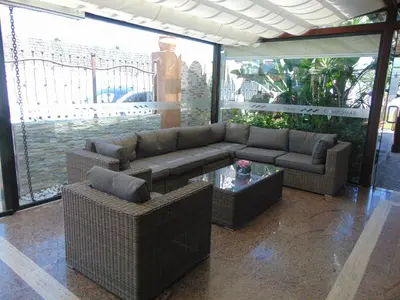 a living room with a couch and a table at Campomar Playa in El Puerto de Santa María