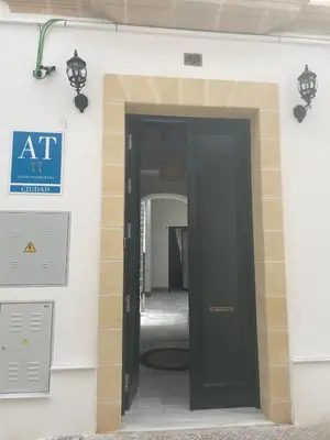 an entrance to a building with a black door at Apartamentos La Higuera by VGH in Jerez de la Frontera