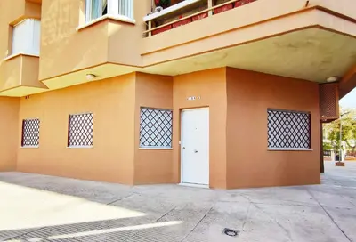 a building with a white door on the side of it at APARTAMENTOS SANLUCAR CASA C in Sanlúcar de Barrameda