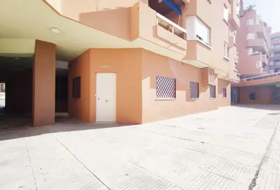 a building with a white door on the side of it at APARTAMENTOS SANLUCAR CASA D in Sanlúcar de Barrameda