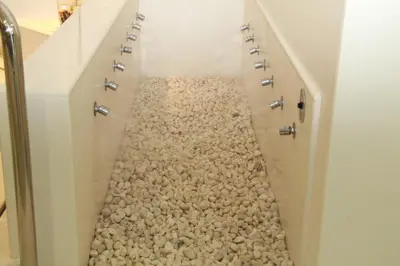 a walkway made out of pebbles in a hallway at Del Mar Hotel & Spa in El Puerto de Santa María