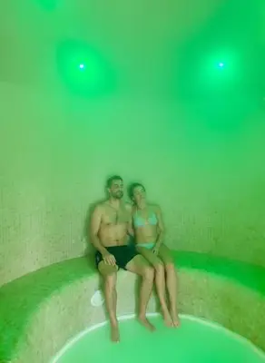 a man and a woman sitting in a bath tub at Del Mar Hotel & Spa in El Puerto de Santa María