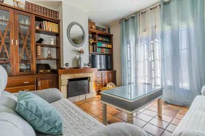 a living room with a couch and a table at Chalet El Santiscal in Arcos de la Frontera