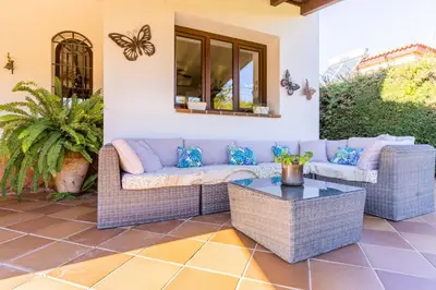 a living room with a couch and a table at Chalet El Santiscal in Arcos de la Frontera