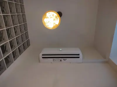 a room with a heater and a clock on the wall at SH Casa de la Catedral. En el centro de la ciudad. in Cádiz