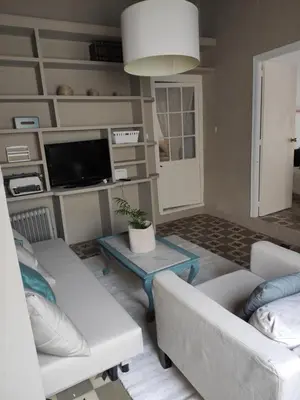 a living room with two couches and a tv at Calle Nueva in Arcos de la Frontera