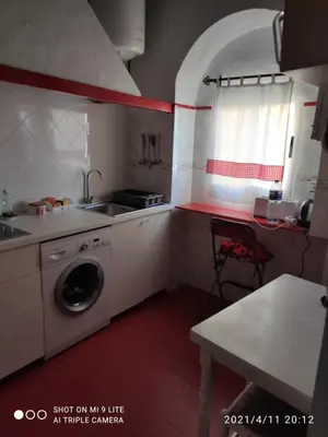 a kitchen with a sink and a washing machine at Calle Nueva in Arcos de la Frontera