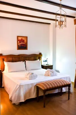 a bedroom with a bed with two towels on it at The Place Bodega Real by ALEGRIA in El Puerto de Santa María