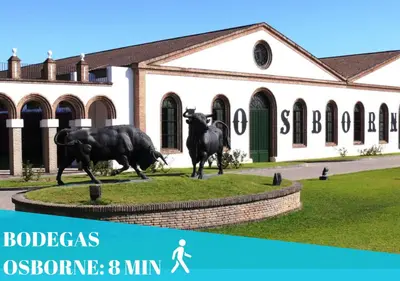 a statue of two bulls in front of a building at Apartamento Duplex casa Palacio rehabilitado centro El Puerto in El Puerto de Santa María
