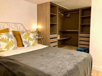 a bedroom with a large bed with pillows at Apartamento Cádiz Costa in Cádiz