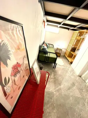 a living room with a red bench in a room at Apartamento Cádiz Costa in Cádiz