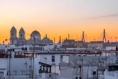a view of a city skyline at sunset at Penthouse with Jacuzzi, and garaje Grupo AC Gestion in Cádiz