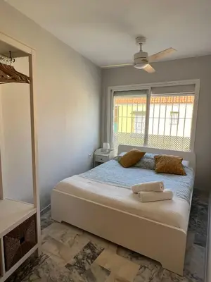 a bedroom with a bed and a window at Golden Hour Grupo AC Gestión in Rota