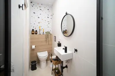a small bathroom with a sink and a mirror at Apartamento Sanlúcar Sunset in Sanlúcar de Barrameda