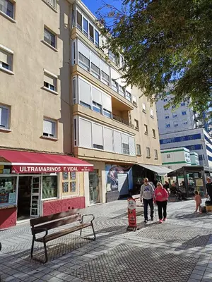 a group of people walking down a city street at Piso Avenida junto a la Playa in Cádiz