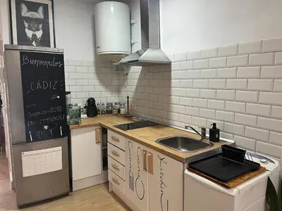 a kitchen with a sink and a counter top at 50m Playa Caleta y Teatro Falla Grupo AC Gestion in Cádiz