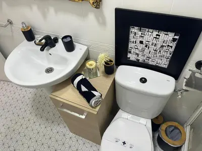 a bathroom with a white toilet and a sink at 50m Playa Caleta y Teatro Falla Grupo AC Gestion in Cádiz