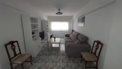 a living room with a couch and two chairs at PISABEL in Sanlúcar de Barrameda