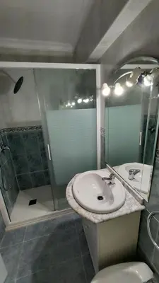 a bathroom with a sink and a shower at PISABEL in Sanlúcar de Barrameda