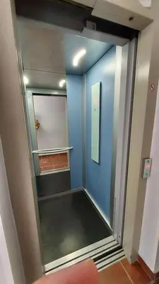a walk in closet with a blue wall at PISABEL in Sanlúcar de Barrameda