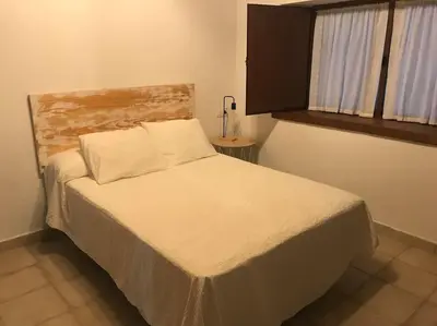 a bedroom with a large bed in a room at Santa Lucía in Jerez de la Frontera